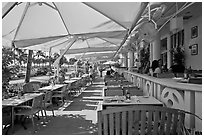 Outdoor restaurant tables, South beach, Miami Beach. Florida, USA (black and white)