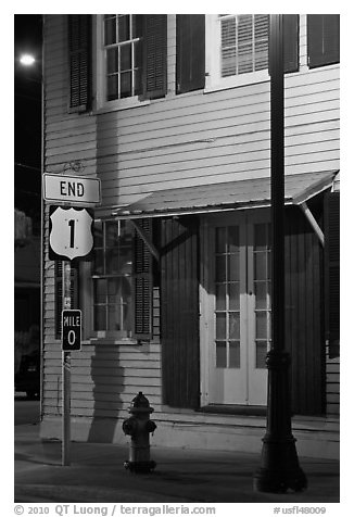 Sign marking end of US route 1. Key West, Florida, USA (black and white)