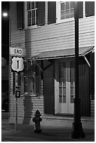 Sign marking end of US route 1. Key West, Florida, USA ( black and white)