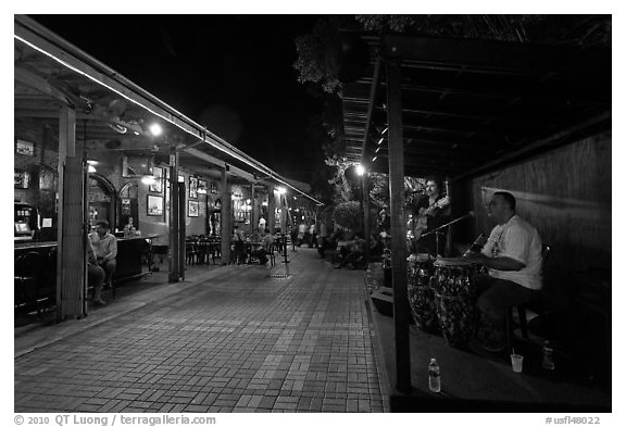 Musicians and restaurant at night, Mallory Square. Key West, Florida, USA (black and white)