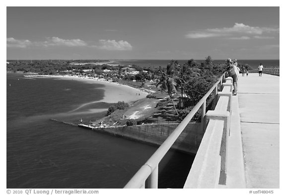 Tourists observing view from old bridge, Bahia Honda Key. The Keys, Florida, USA