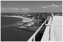 Tourists observing view from old bridge, Bahia Honda Key. The Keys, Florida, USA (black and white)