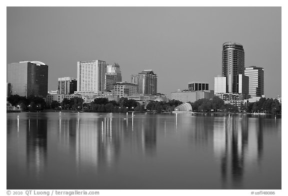 Skyline at dawn from lake Eola. Orlando, Florida, USA