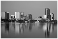 Skyline at dawn from lake Eola. Orlando, Florida, USA (black and white)