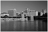Fountains and morning skyline from Lake Lucerne. Orlando, Florida, USA (black and white)