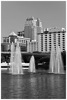 Fountains and downtown high-rises from Lake Lucerne. Orlando, Florida, USA (black and white)