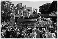 Crowds attends parade with Mickey and Minnie characters. Orlando, Florida, USA ( black and white)