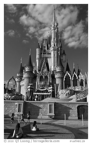 Girls in front of Cindarella castle, Walt Disney World. Orlando, Florida, USA (black and white)