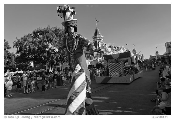 Character on stilts during parade, Main Street. Orlando, Florida, USA (black and white)