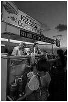 Key West conch fritters food stand at sunset. Key West, Florida, USA (black and white)