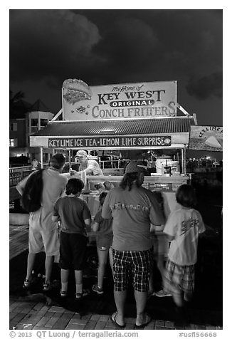 Key lime and conch fritters food stand at night. Key West, Florida, USA (black and white)