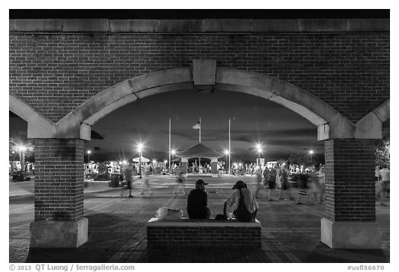 Mallory Square at dust seen through arches. Key West, Florida, USA (black and white)