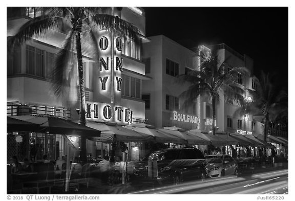 Art Deco hotels colorfully illuminated and traffic light trails, South Beach, Miami Beach. Florida, USA (black and white)