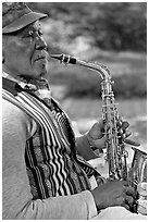 African-American musician with saxophone in square. Savannah, Georgia, USA ( black and white)