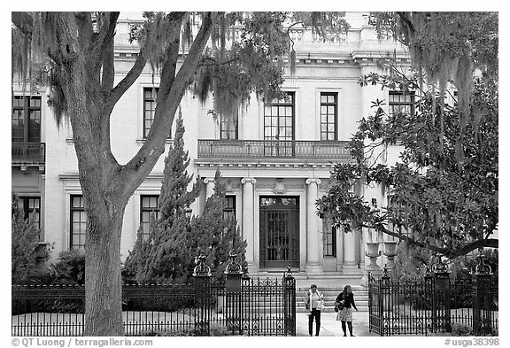 Women walking out of mansion. Savannah, Georgia, USA (black and white)