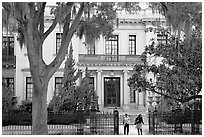 Women walking out of mansion. Savannah, Georgia, USA (black and white)