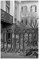 Fence and yard in front of historic house. Savannah, Georgia, USA (black and white)