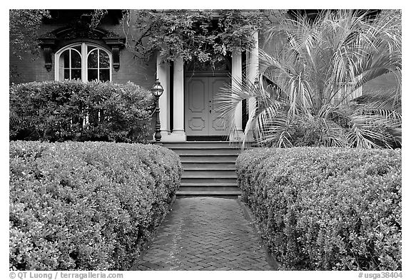 House entrance with garden, historical district. Savannah, Georgia, USA (black and white)