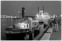 Ferry and riverboat on Savannah River at dusk. Savannah, Georgia, USA (black and white)