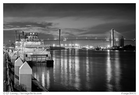 Riverboat and Savannah Bridge at dusk. Savannah, Georgia, USA (black and white)