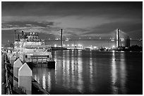 Riverboat and Savannah Bridge at dusk. Savannah, Georgia, USA (black and white)