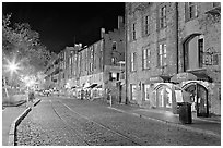 Brick and cobblestone waterside promenade. Savannah, Georgia, USA ( black and white)