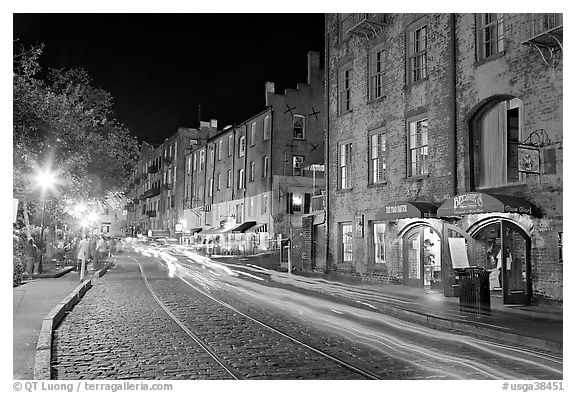 Car lights on River Street by night. Savannah, Georgia, USA