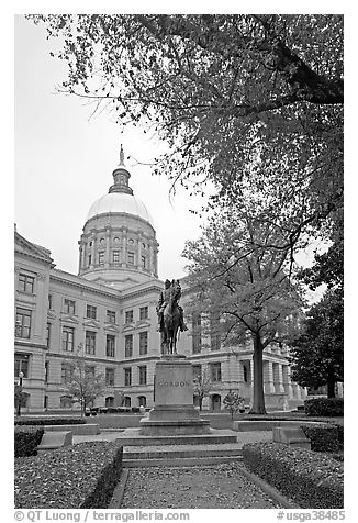 Statue and Georgia Capitol in fall. Atlanta, Georgia, USA