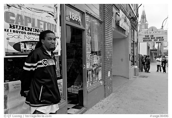 Man standing in front of music store, sweet Auburn. Atlanta, Georgia, USA (black and white)