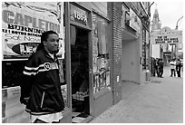 Man standing in front of music store, sweet Auburn. Atlanta, Georgia, USA (black and white)