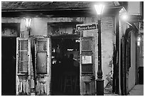 Cafe on Bourbon street at night, French Quarter. New Orleans, Louisiana, USA (black and white)