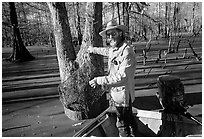 Bayou guide of French descent retriving net,  Lake Martin. Louisiana, USA ( black and white)