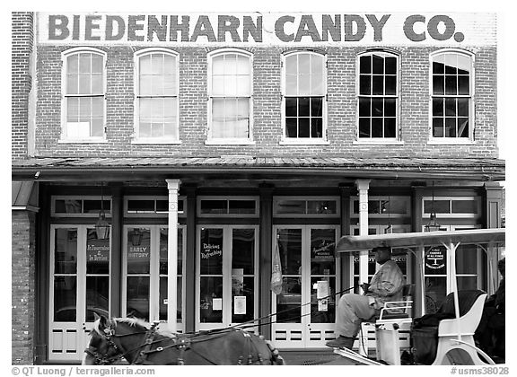 Horse carriage in front of Biedenharn Candy building. Vicksburg, Mississippi, USA (black and white)