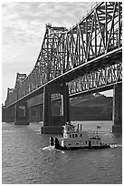 Tugboat under brige on Mississippi River. Natchez, Mississippi, USA (black and white)