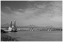 Mississippi River, paddle steamer, and bridge. Natchez, Mississippi, USA (black and white)
