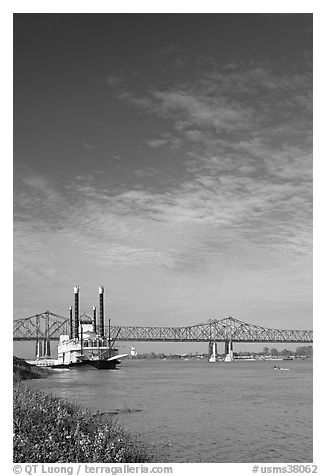 Mississippi River, paddle riverboat, and bridge. Natchez, Mississippi, USA