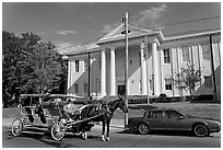 Horse carriage in front of the courthouse. Natchez, Mississippi, USA (black and white)