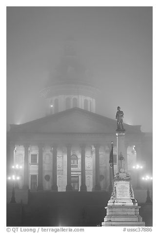 Monument and state capitol in fog at night. Columbia, South Carolina, USA