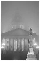 Monument and state capitol in fog at night. Columbia, South Carolina, USA (black and white)