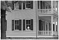 House with lamp inside window. Columbia, South Carolina, USA (black and white)