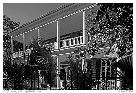 Facade of house with balconies and columns. Charleston, South Carolina, USA (black and white)