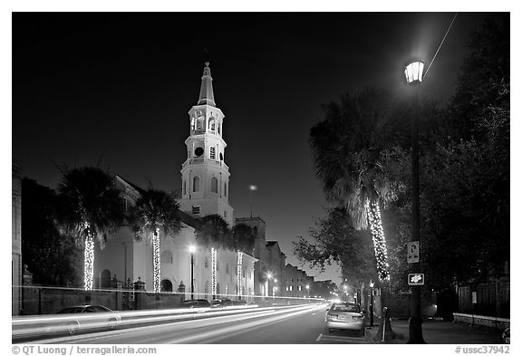 St Michael Episcopal Church and street with traffic at night. Charleston, South Carolina, USA