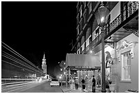 Street, church, and Mills house hotel with many guests at night. Charleston, South Carolina, USA ( black and white)
