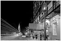 Street, church, and Mills house hotel with many guests at night. Charleston, South Carolina, USA (black and white)