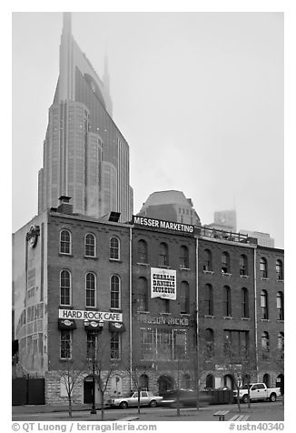 Row of brick buildings and Bell South Tower in fog. Nashville, Tennessee, USA