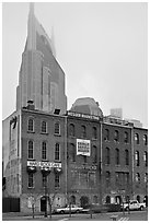 Row of brick buildings and Bell South Tower in fog. Nashville, Tennessee, USA (black and white)