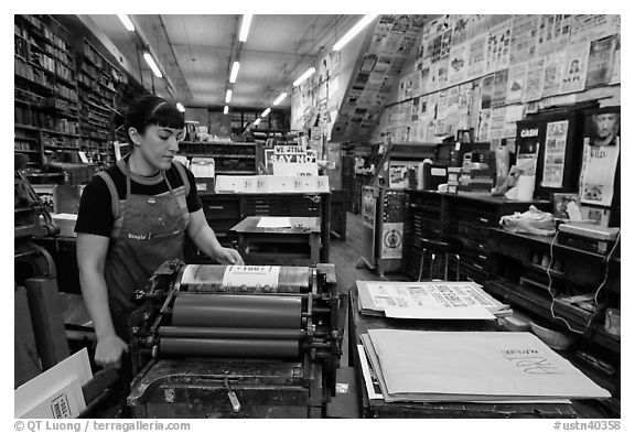 Woman printing poster at Hatch Show print. Nashville, Tennessee, USA (black and white)