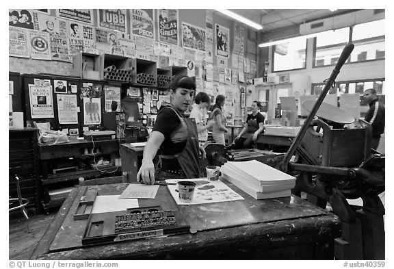 Woman reaching for colored inks, Hatch Show print. Nashville, Tennessee, USA (black and white)
