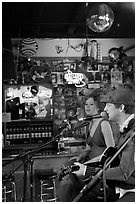 Man and woman singing country music at Tootsie Orchid Lounge. Nashville, Tennessee, USA ( black and white)