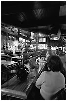 Patrons listen to musical performance in Beale Street bar. Memphis, Tennessee, USA (black and white)